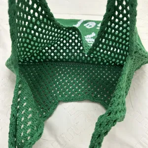 Grünes Häkel-Netz-Tragetasche Detail, hohles Strickmuster, lässige Sommer Handtasche
