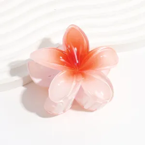 Pink gradient plumeria flower hair claw clip, detailed close-up view of resin floral design.