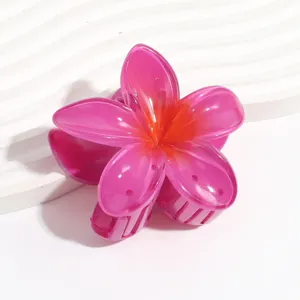 Transparent jelly pink plumeria flower hair claw clip for women summer daily hair styling accessory.
