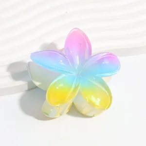 Close-up detail of a colorful gradient floral hair claw clip with pearlescent jelly finish.