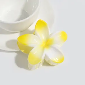 Plumeria flower hair claw clip detail, jelly yellow aesthetic hair accessory for women summer.