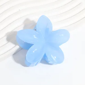 Detailed shot of a light blue jelly flower hair claw clip, perfect for summer hairstyles.