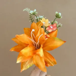Artificial orange lily flower hair clip accessory, vibrant floral design for summer style.