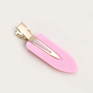 Molla per capelli rosa a goccia con design dorato, accessorio di styling quotidiano.