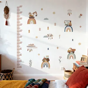 Detail view of kids height growth chart wall sticker with construction vehicles for nursery decor.