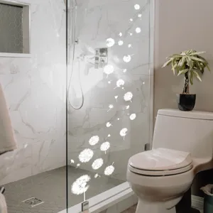 Adhesivo electrostático de diente de león blanco para ventana de vidrio extraíble.