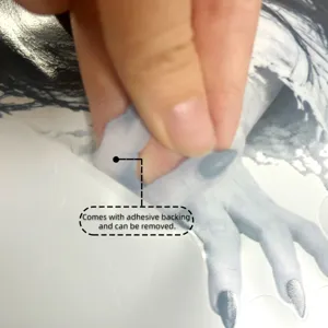 Detail shot of the Halloween ghost wall sticker showing adhesive backing and peeling feature.