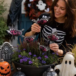 Halloween butterfly garden stakes with skull patterns for outdoor yard and potted plant decor.