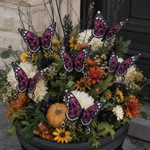 Details of the Halloween butterfly stakes featuring skull patterns in a decorative garden planter.