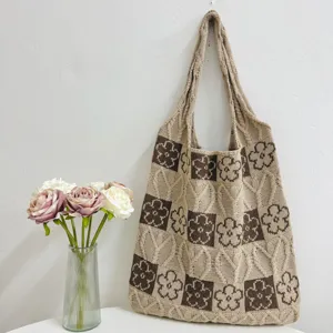 Knitted floral tote bag detail view, vintage aesthetic shoulder bag with large capacity for daily use.