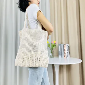 Beige knit tote bag for women, large capacity hollow shoulder bag, casual beach shopping bag.