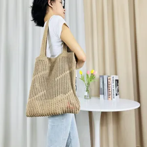 Casual beige knitted tote bag for women, large capacity hollow shoulder handbag beach bag.