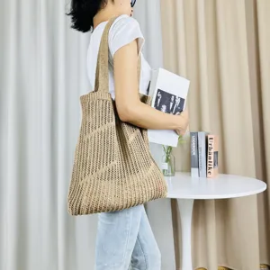 Beige knitted hollow-out shoulder tote bag, casual large capacity beach bag for women daily use.