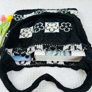 Black white knitted floral tote bag detail showing large capacity, aesthetic knit shoulder bag.