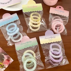 Macaron telephone wire hair ties set, colorful plastic hair coils for secure ponytail styling.