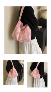 Rosa gestrickte Umhaengetasche fuer Damen, laessige Strick Tasche mit Muster fuer den Alltag.