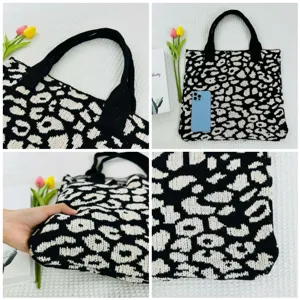 Detailansicht der schwarz-weißen Leoparden-Stricktasche mit weicher Textur und stabilen Henkeln.