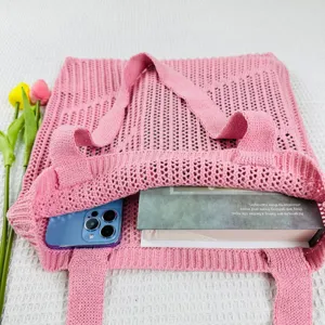 Pink knit hollow tote bag detail, casual shoulder bag with large capacity and stylish texture.