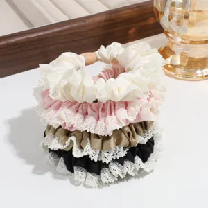 Elegant satin hair scrunchies detail view featuring delicate lace trim in multiple colors.