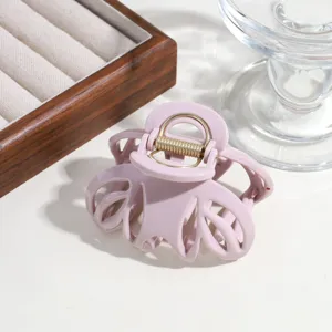 Minimalist solid color hollow pumpkin hair claw clip, elegant pink hair accessory for daily wear.
