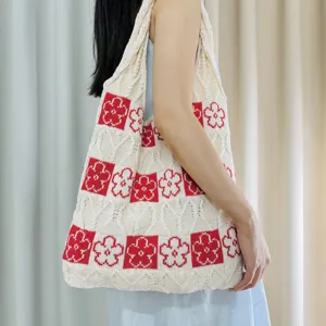 Knitted flower pattern tote bag detail, casual shoulder bag with red white knit design.
