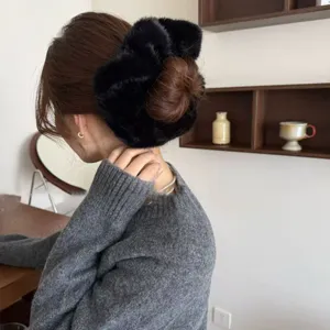 Oversized black faux rabbit fur hair scrunchie, soft fluffy plush hair tie for elegant styling.