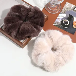 Oversized plush hair scrunchie, soft faux rabbit fur hair tie, elegant spring fashion.