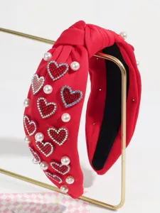 Red knotted headband with rhinestone hearts and pearls, sweet fashion hair accessory detail