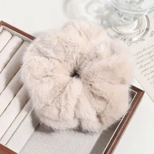 Fluffy faux fur hair scrunchie detail view, soft plush large hair tie for women and girls.