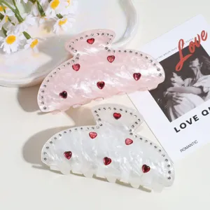 Pinzas para el pelo bonitas de moda coreana con diamantes de imitación y dijes de corazón.
