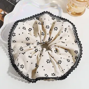 Large floral print hair scrunchie with black lace trim, elegant hair accessory for women.