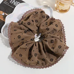 Large brown floral hair scrunchie with delicate lace trim, perfect for daily styling.