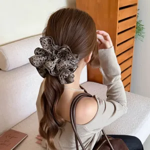 Oversized leopard print hair scrunchie stylish elegant hair tie for women daily styling.