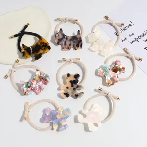 Cute acetate animal hair ties detail shot, featuring adorable dog and bear design elastics.