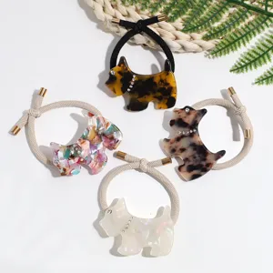 Detailed view of cute acrylic Scottie dog hair ties with elastic bands and sparkling rhinestones.