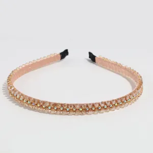 Close-up detail of champagne rhinestone beaded hair hoop crystal headband accessory