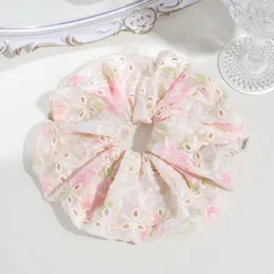 Sweet floral embroidered scrunchie detail view, elegant hair accessory for daily styling.