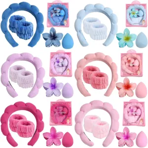 Makeup headband and wristband set with flower hair claw clip and sponge for cleansing.