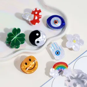 Cute mini acrylic hair claw clips set with various trendy shapes like flowers and smiley faces.