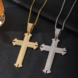 Detailed closeup view of stylish iced out cross pendant necklaces in gold and silver colors.
