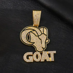 Close-up detail of the gold goat pendant with sparkling zircon stones in bold hip-hop style.