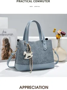 Details of the blue-grey commuter tote bag with stylish rocking horse charm and strap.