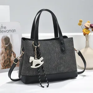 Stylish patchwork tote bag with cute rocking horse pendant, large capacity commuter shoulder bag.