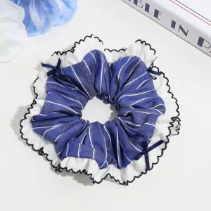 Detailed view of a sweet double-layer striped scrunchie with cute ruffles and mini bows.
