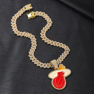Gold iced out Cuban chain necklace with Miami Heat flaming basketball pendant for hip hop style.
