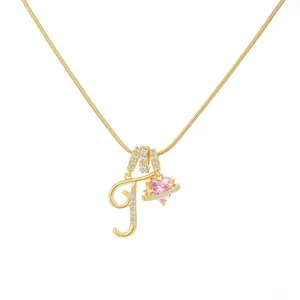 Exquisite gold-plated initial letter necklace featuring a sparkling pink heart crystal pendant.