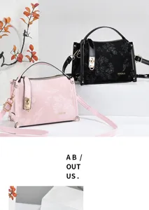 Stylish floral embossed women handbag with metal lock top handle mini crossbody bag.