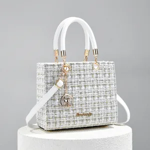 Elegant white tweed top handle bag for women, luxury style shoulder crossbody bag with gold hardware.