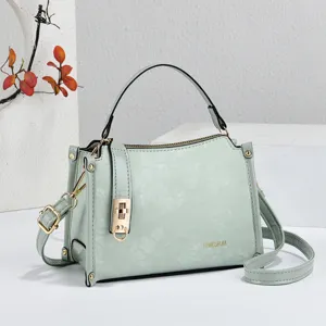 Mint green floral embossed women handbag, stylish mini crossbody bag with top handle.