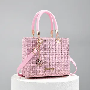 Pink tweed handbag for women, chic top handle shoulder crossbody bag with gold hardware.